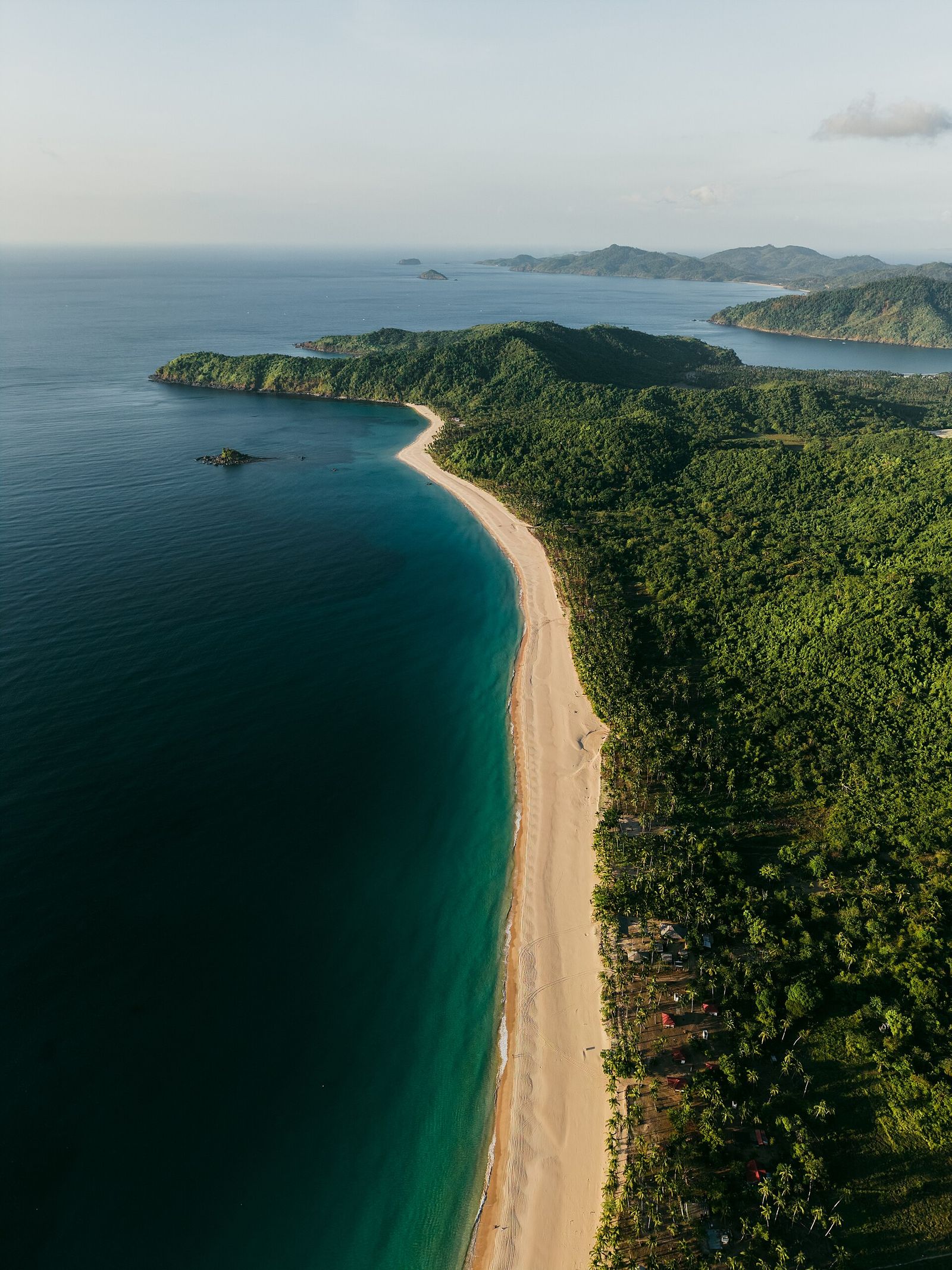 Long sweep of Nacpan Beach seen from above, northern Palawan